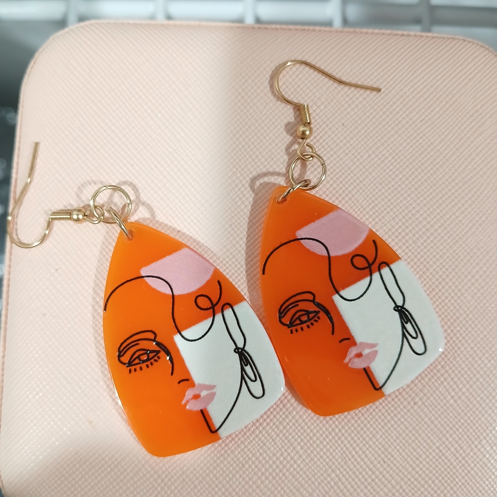 Abstract Face Orange and White Earrings